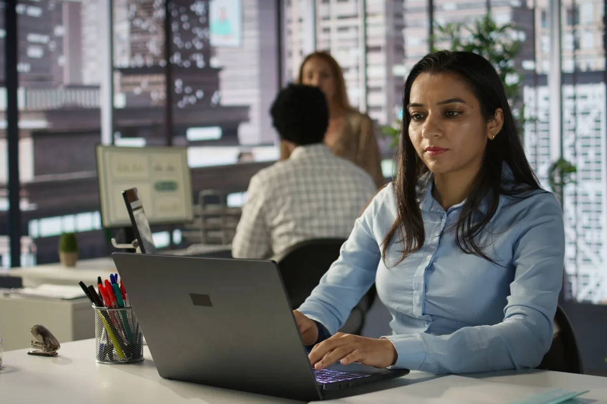 A consultant reviewing a website on a laptop